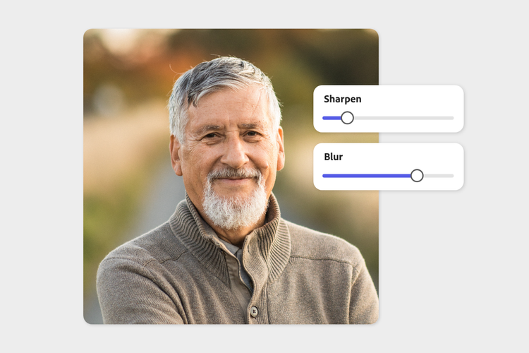 A person with a beard smiling Description automatically generated