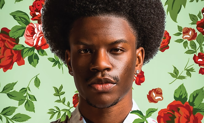 Closeup of Isaiah Everett superimposed on floral background with some of the flowers and leaves intermingling into the foreground.