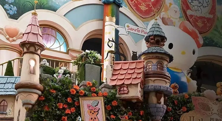 Foto af Sanrio Puroland, der indeholder slotte og Hello Kitty