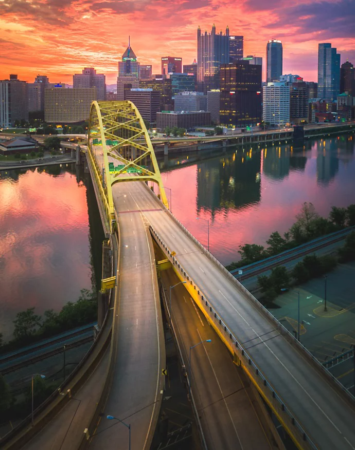 HDR photo of a bridge connecting to a city