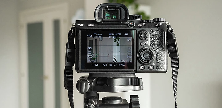 A DSLR camera on a tripod