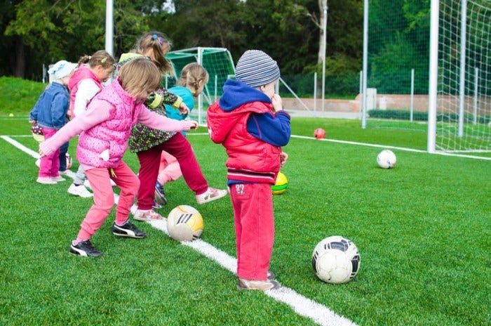 Children Learning through Playing Soccer