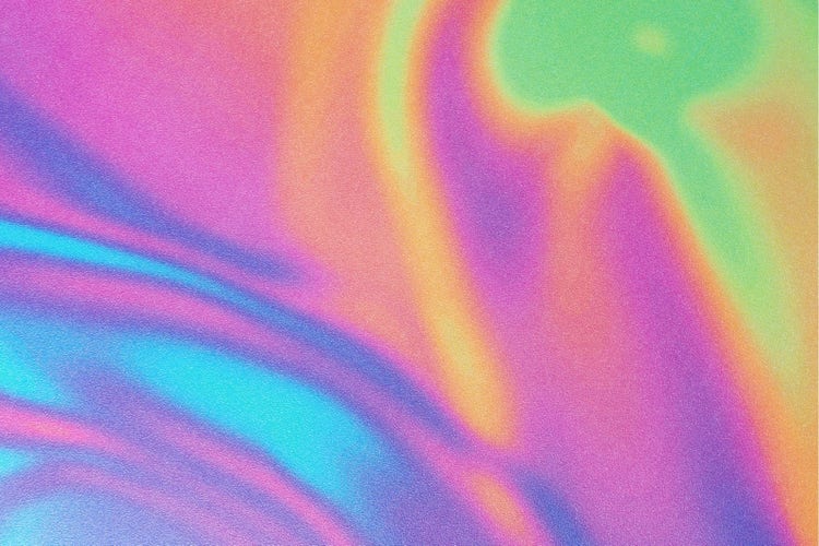 A grainy psychedelic image with light blue, purple, yellow, and green streaks of color layered over one another.