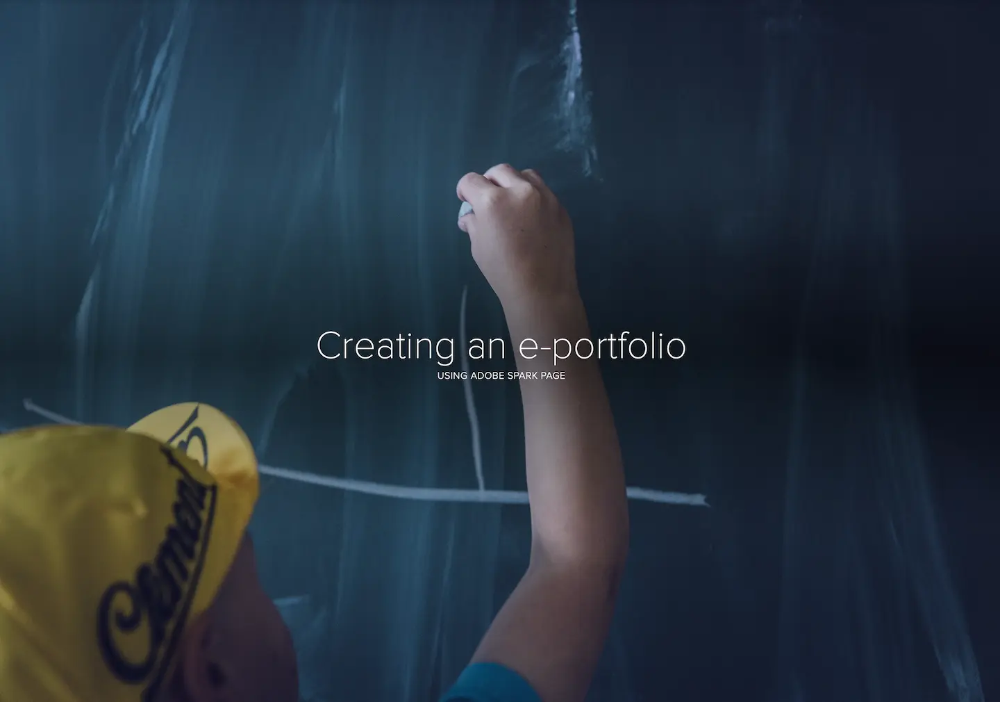 Boy writing on a chalkboard