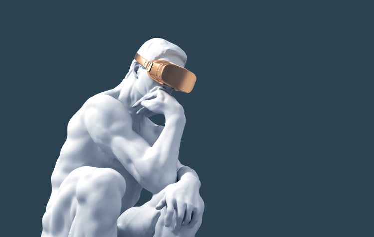 Une statue inspiré du penseur de Rodin porte un casque de VR