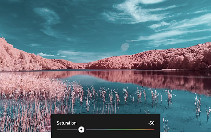 Photographie peu saturée d’un fleuve traversant une forêt rougeâtre, sur laquelle est superposée la barre de réglage de la saturation