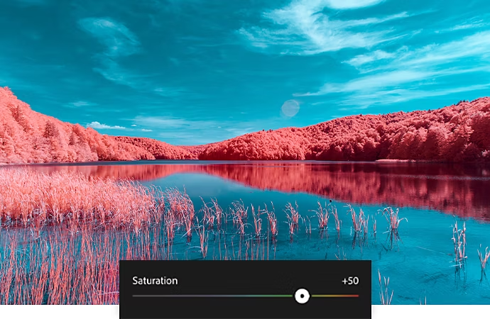 Photographie très saturée d’un fleuve traversant une forêt rougeâtre, sur laquelle est superposée la barre de réglage de la saturation