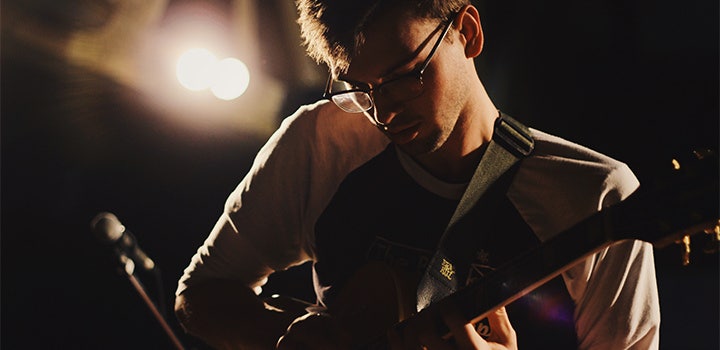 Action headshot of a focused musician performing.