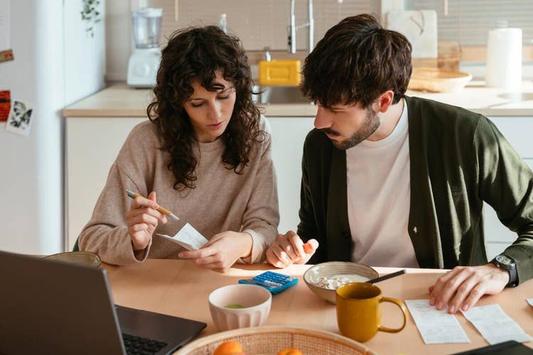 A photo of two people discussing a collateral loan agreement.