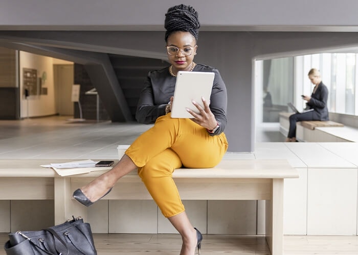 A business person reviews a contract on a table