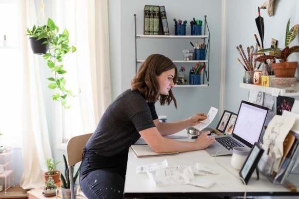 A photo of a person checking their itemized receipts.