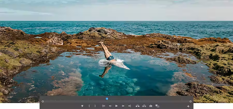 一個人跳入海灘潮汐池的影像，影片編輯器功能列停留在修剪的影像上方