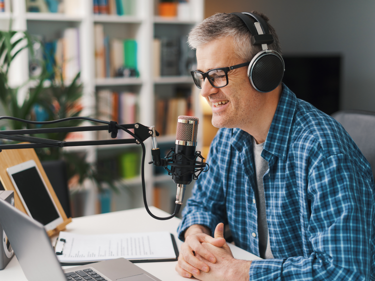 photo of a man recording training materials at his desk