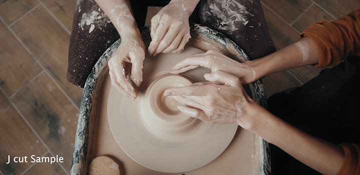 https://main--cc--adobecom.hlx.page/cc-shared/fragments/modals/videos/creativecloud/video/discover/j-cut#jcut | A J cut editing technique applied to a video footage of people working at a pottery wheel together | :play-medium