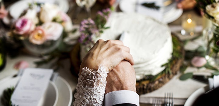 Capturing the moment a bride and groom cut the cake at their wedding.