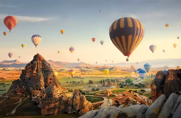 Wide angle master shot of a hot air balloon festival.