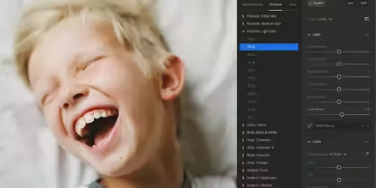 Photo of a laughing school-aged child with short blond hair on a white background, open in the Lightroom interface.