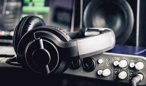 Photo of headphones and other recording equipment.