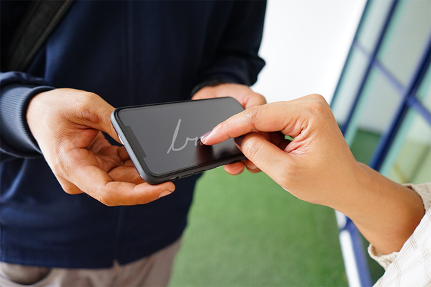 A woman using e-signature to digitally sign