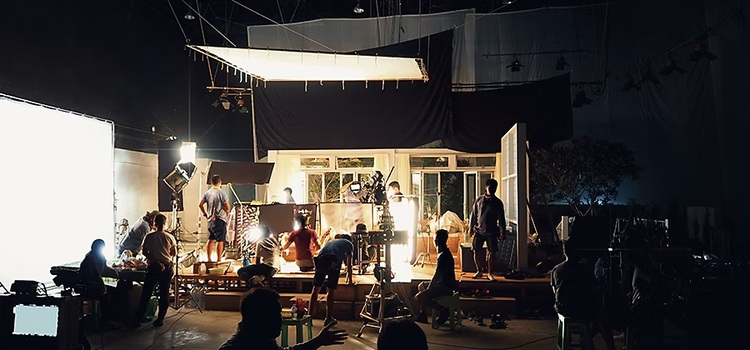 A video crew prepping a professional video production set to shoot a script