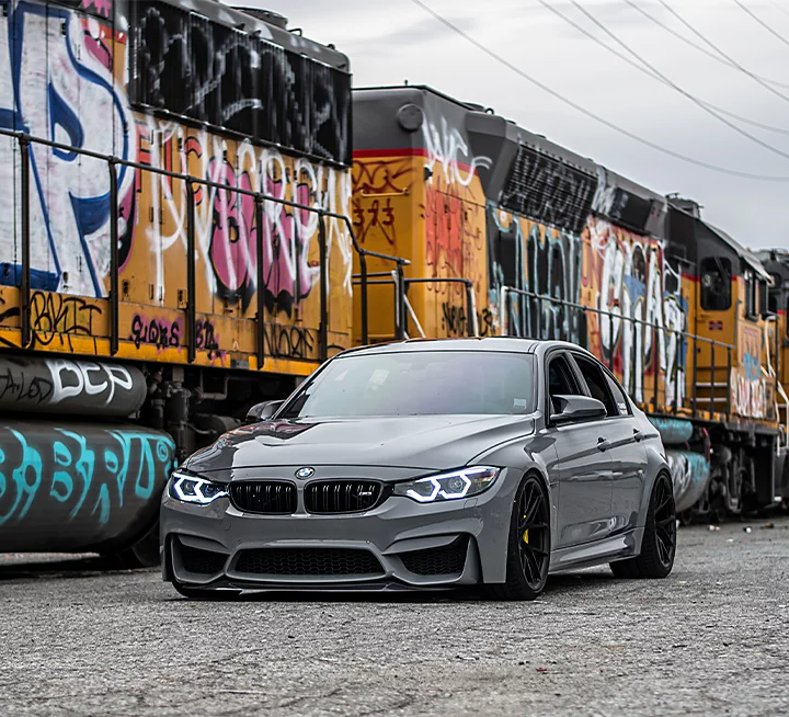 A car next to a train