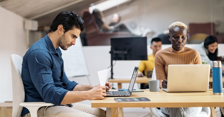 Business colleagues working in an open office layout