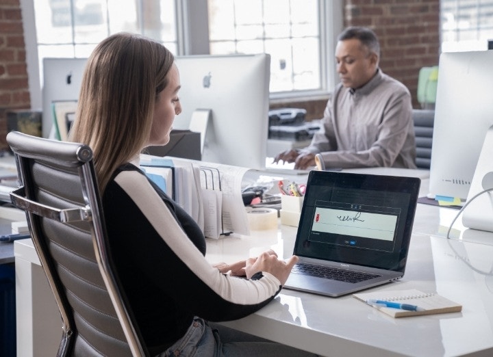 An office worker looking over their signature on a transcript request in Adobe Acrobat Sign