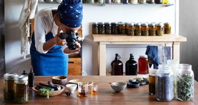 A small business owner taking photographs of their products for their website