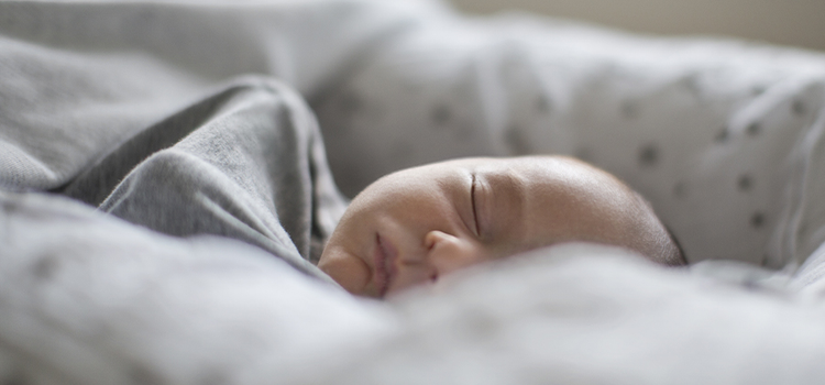 photo of a sleeping newborn baby