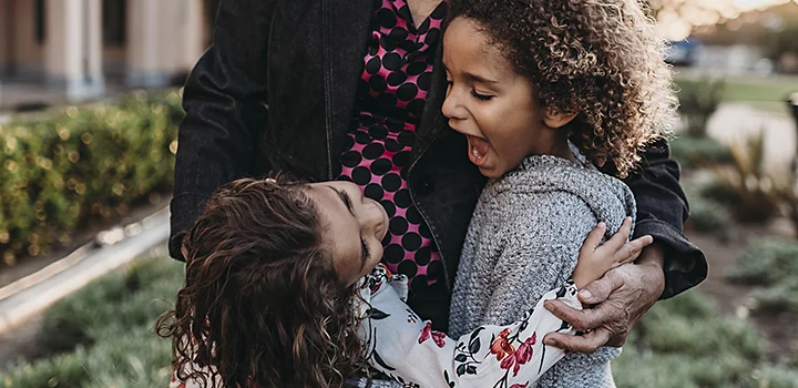 Two children making faces at each other