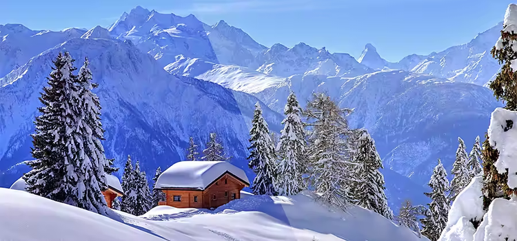 A snow-covered cabin on top of a snowy mountain demonstrating white balance in photography