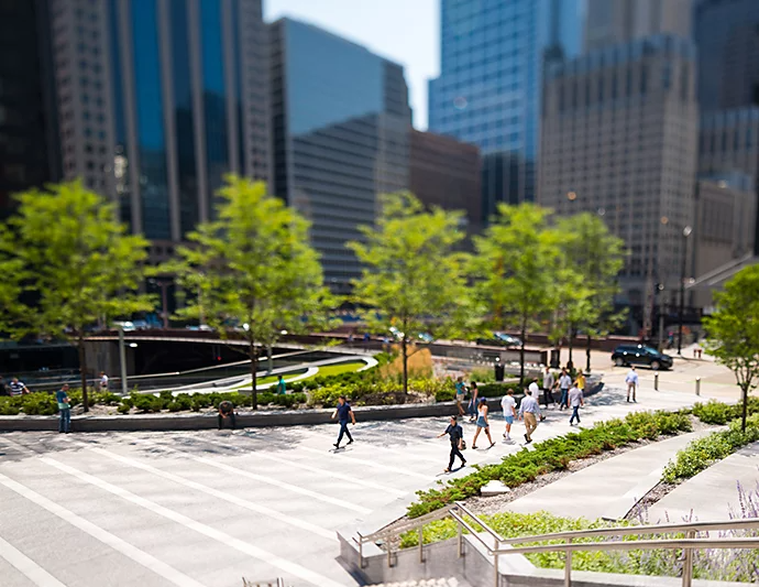 People walking through a large walkway between buildings