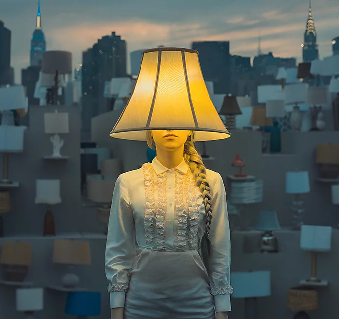 A model with a lampshade on their head with a bunch of lamps behind them