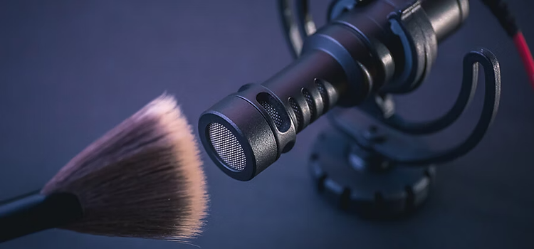 Makeup brush being used to make an ASMR audio recording