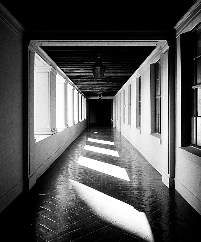 A black-and-white photo of a hallway as an example of perspective photography