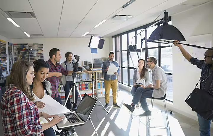 A video production crew recording two actors