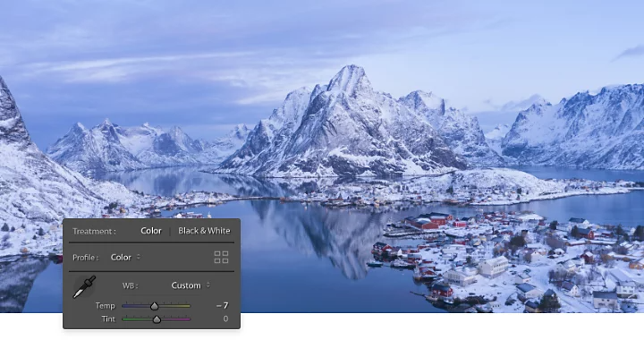 Photo of a snowed over village being colour corrected