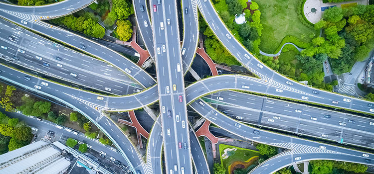 Aerial image of intersecting freeways and overpasses.