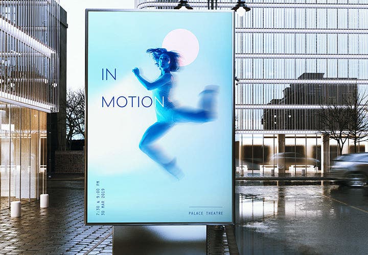 Image with Path Blur set in poster placeholder in front of two city buildings.