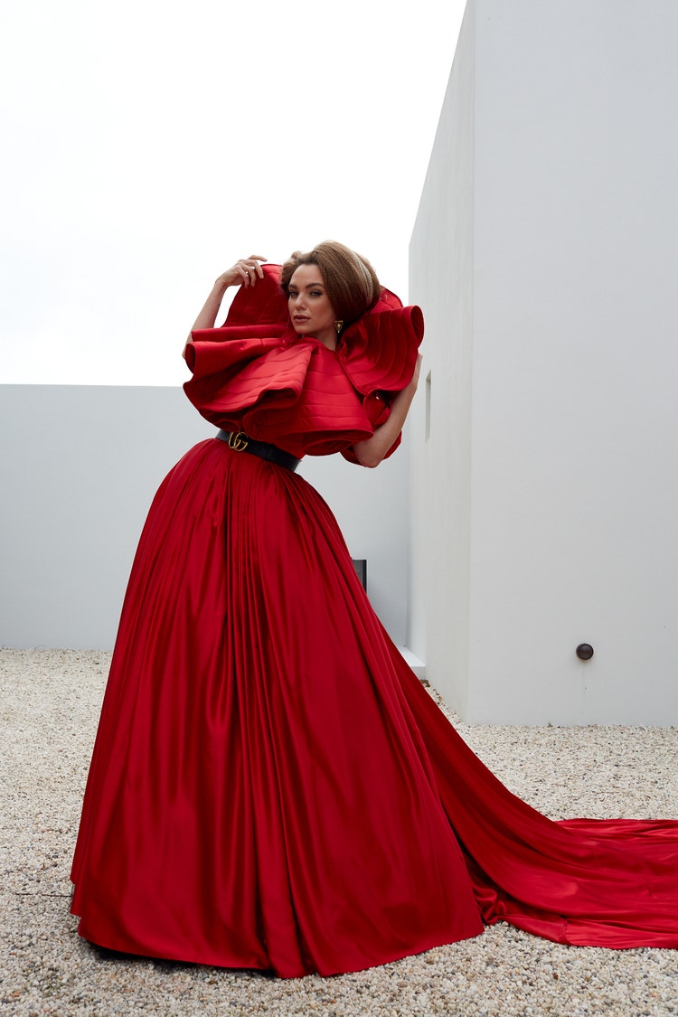 Before fashion photography image of model in red dress posing