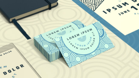 Stack of sample business cards with circular blue patterns and Lorem Ipsum text.