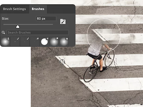A photo of a person biking on the street. The person has been partly erased using the Clone Stamp tool.