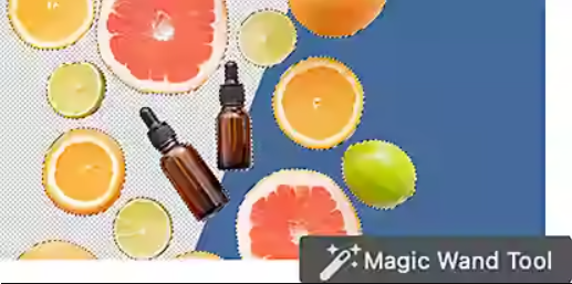 An image with multiple glass bottles and sliced grapefruit pieces selected in Adobe Photoshop with the Magic Wand tool