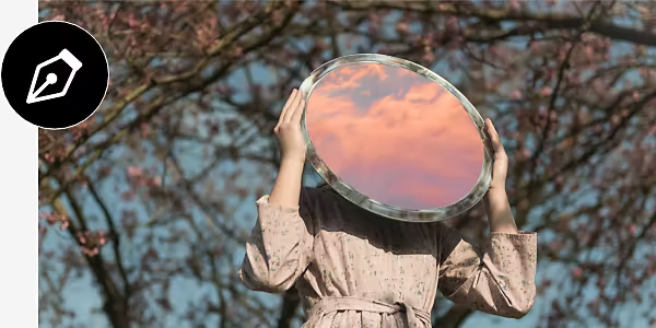 Adobe Photoshop logo superimposed on a photo of a person holding a mirror.