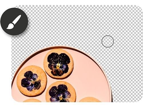 A plate of cookies with edible flowers being blended into the background with the Brush tool and icon overlaid