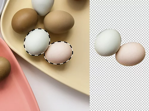 An image of eggs on a plate. Two of the eggs have been selected and isolated into their own layer.