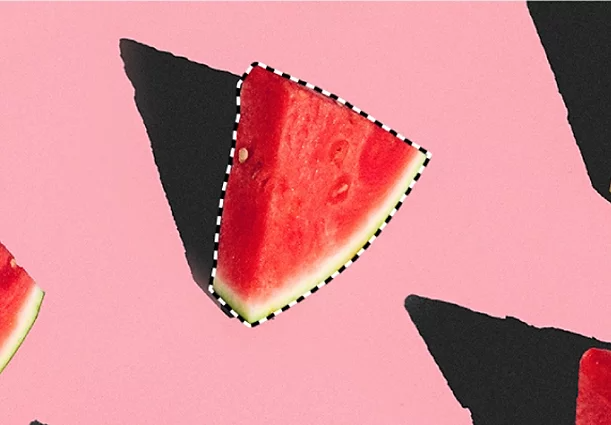 An image showing two pieces of watermelon. One of the pieces of watermelon has been selected using the Quick Selection tool and has a dotted line border around it.