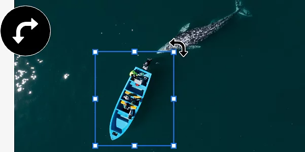An image of a boat and a whale in the ocean. The boat has been separated into its own layer, which has a bounding box around it so that it can be rotated.