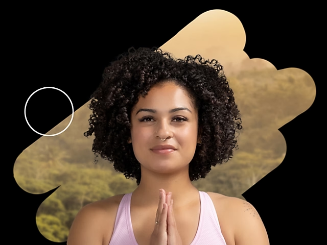 Using black and white brushes to conceal the background of a woman with yoga prayer hands