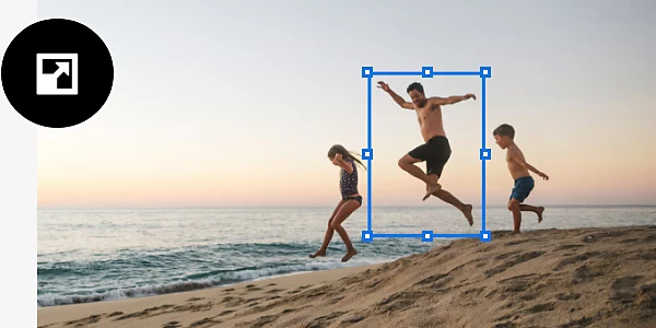The Free Transform tool outline with icon overlaid is used to select the middle of three children playing on a beach